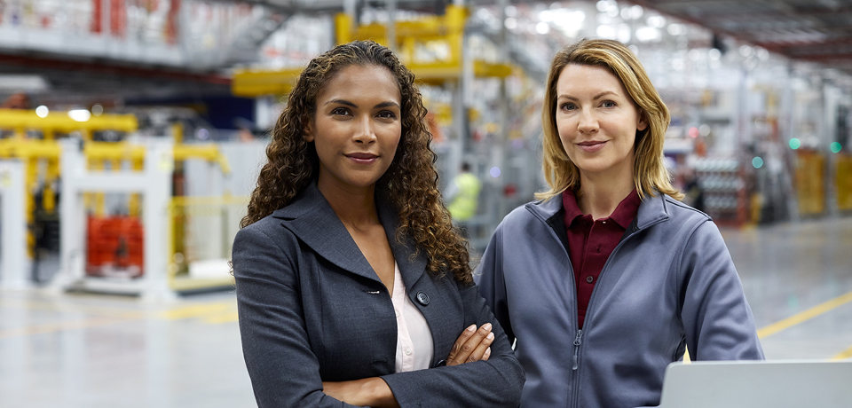 Female professionals in car plant